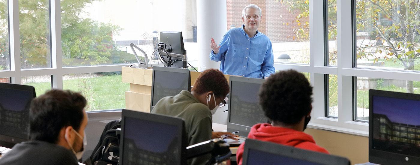 A Frostburg professor teaches in a computer lab in the Compton Science Center